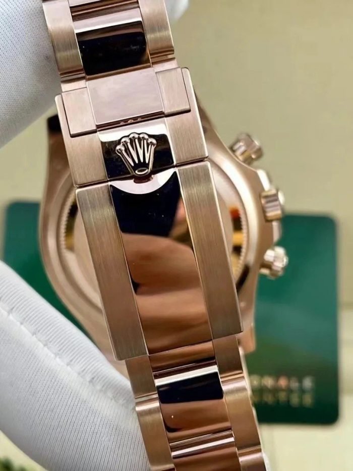 The Oyster Perpetual Cosmograph Daytona in 18 ct Everose gold features a diamond-set gloss black and sunrise gold dial and an Oyster bracelet with an engraved tachymeter on an 18-carat Everose gold bezel. -m126505-0002 40mm - Image 6