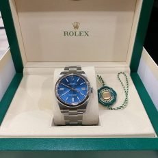 The Oyster Perpetual 41 is presented with a bright blue dial and an Oyster bracelet. -m124300-0003 - Image 28